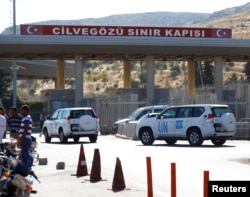 U.N. vehicles enter Syria from Turkey at Cilvegozu border gate, located opposite the Syrian commercial crossing point Bab al-Hawa in Reyhanli, Hatay province, Turkey, Sept. 16, 2016.