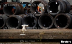 A dock worker is seen on a quayside at Associated British Ports Goole facility in Goole, Britain August 2, 2018. Picture taken August 2, 2018. REUTERS/Phil Noble
