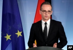 FILE - German Foreign Minister Heiko Maas addresses the media in Berlin, Germany, Nov. 27, 2018.
