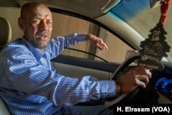 Ahmed Faraag supports three children by driving a taxi in Cairo. He says he won’t vote because it is not worth giving up his time at work, April 17, 2019.