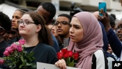 Mourners listen to speakers June 21, 2017, in Reston, Va., during a vigil in honor of Nabra Hassanen. Islamic leaders say the beating death of Nabar looks all too much like a hate crime.
