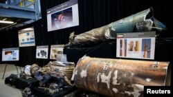 FILE - A U.S. Department of Defense exhibit shows a Qiam ballistic missile manufactured in Iran, at a military base in Washington, Nov. 29, 2018.