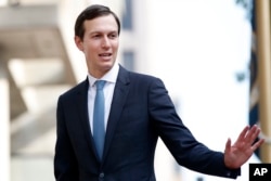 FILE - White House Adviser Jared Kushner waves as he arrives at the Office of the United States Trade Representative in Washington, Aug. 29, 2018.