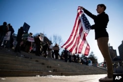 Protesters demonstrate ahead of Pennsylvania's 58th Electoral College at the state Capitol in Harrisburg, Pennsylvania, Dec. 19, 2016.