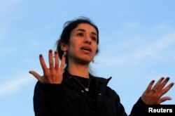 FILE - Nobel Peace Prize laureate, Yazidi activist Nadia Murad, gestures while talking to the people during her visit to Sinjar, Iraq, Dec. 14, 2018.