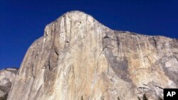 This photo shows El Capitan in Yosemite National Park, Calif. An American rock climber has become the first to climb alone to the top of the wall without ropes or safety gear.