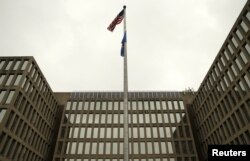 The U.S. national flag is pictured at the Office of Personnel Management building in Washington, June 5, 2015.