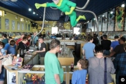 Clients comb through comic books at Heroes Aren't Hard to Find in Charlotte, North Carolina