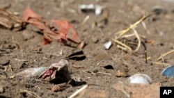 In this Sept. 9, 2018 photo, plastic waste sits on a freshly cultivated field in Nauen, Germany. (AP Photo/Ferdinand Ostrop)