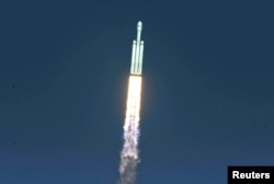 A SpaceX Falcon Heavy rocket lifts off from historic launch pad 39-A at the Kennedy Space Center in Cape Canaveral, Florida, Feb. 6, 2018.