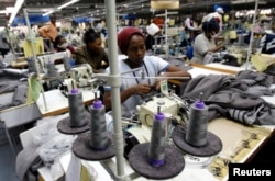 FILE - Kenyan workers prepare clothes for export at a factory in Athi River, near the Kenyan capital, Nairobi, July 31, 2009.