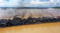 Dredging barges operated by illegal miners converge on the Madeira river, a tributary of the Amazon, searching for gold, in Autazes, Amazonas state, Brazil, Nov. 25, 2021.