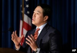 U.S. Attorney Joon Kim speaks to reporters during a news conference in New York, Dec. 12, 2017.
