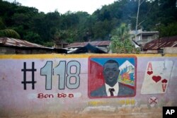 FILE - A mural feature senatorial candidate Guy Philippe in Pestel, Haiti, Aug. 25, 2016.