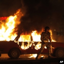Army soldiers run after Egyptian Coptic demonstrators in Cairo, Egypt Sunday, Oct. 9, 2011.
