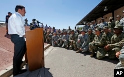 Arizona Republican Gov. Doug Ducey speaks to Arizona National Guard soldiers prior to deployment to the Mexico border at the Papago Park Military Reservation in Phoenix, April 9, 2018.