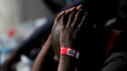 FILE: A migrant intercepted aboard a dinghy off the coast in the Mediterranean Sea, is seen with scabies on his body, after arriving on a rescue at the port of Malaga, southern Spain July 7, 2018.