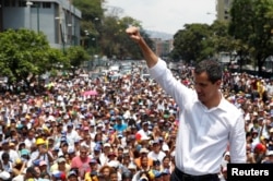 FILE - Venezuelan opposition leader Juan Guaido gestures as he speaks to supporters during a rally against the government of President Nicolas Maduro.