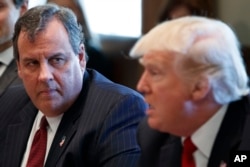 New Jersey Governor Chris Christie listens as President Donald Trump speaks during an opioid and drug abuse listening session, March 29, 2017, in the Cabinet Room of the White House in Washington.