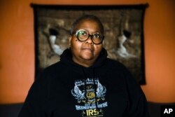 Nora Brooks, a furloughed customer service representative for the Internal Revenue Service, poses for a photograph at her home in Philadelphia, Pennsylvania, Jan. 3, 2019. Brooks worries about whether she will need to seek a second job.