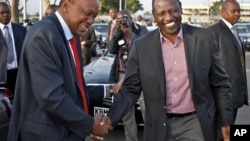 Before departing for AU summit in Addis Ababa, Kenyan President Kenyatta, left, with Deputy President Ruto, Nairobi, Kenya, Oct. 12, 2013.