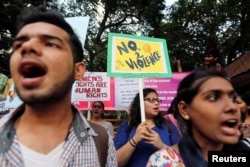 FILE - Demonstrators shout slogans during a protest against the rape and murder of a law student in the southern state of Kerala, in Mumbai, India, May 11, 2016.