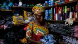 hade Ajayi, 50, shops for thread for her bag-making business, at a store in Ilorin, Kwara state, March, 26, 2021. REUTERS/Temilade Adelaja