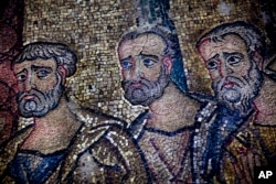 A cracked mosaic is prepared for restoration inside the Church of the Nativity, in the West Bank city of Bethlehem, Feb. 4, 2016.