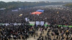 Iranians gather to voice their anger after their province's lifeblood river dried up because of drought and diversion, in the central city of Isfahan, Nov. 19, 2021.