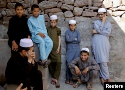 Students wait for prayer time at the Al-Nadwa Madrassa in Murree, Pakistan, Oct. 24, 2017.