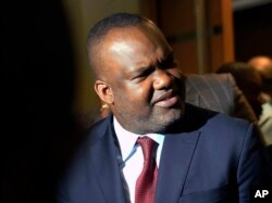 FILE - Corneille Nangaa, the president of the independent electoral commission (CENI), leaves a meeting with opposition candidates and African Union observers in Kinshasa, Congo, Jan. 2, 2019.