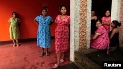 Pregnant teenagers stand at the entrance of a maternity home in Jinotega city, some 160 km (99 miles) north of Managua October 24, 2013. According to the United Nations Population Fund (UNFPA), Nicaragua has one of the highest rates of teenage pregnancy in Latin America where between 13,000 and 16,000 adolescents give birth every year, counting for about 16% of the total births in the country. Picture taken October 24, 2013. REUTERS/Oswaldo Rivas