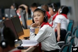 In this June 16, 2017, photo, North Korean students use computer terminals at the Sci-Tech Complex in Pyongyang, North Korea.
