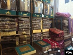 Enjoying the relative peace and prosperity selling men's clothes in Riyadh, some Yemeni workers say they, too, believe Iran is funding and providing weapons for Houthi militants fighting in Yemen, Jan. 26, 2016. (H. Murdock/VOA)