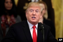 President Donald Trump speaks about crude pipe bombs targeting Hillary Clinton, former President Barack Obama, CNN and others, in the East Room of the White House, Oct. 24, 2018, in Washington.