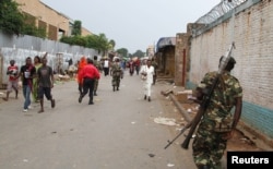 FILE - A soldier patrols the streets after a grenade attack of Burundi's capital Bujumbura, Feb. 3, 2016.