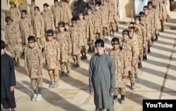 FILE - А YouTube screen grab from an Islamic State propaganda video shows child soldiers at an alleged IS training camp. Many of the children are reportedly taken from captured families and civilians living in IS-controlled areas.