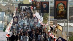 Irački studenti okupljaju se 31. decembra 2020. da obeleže godišnjicu ubistva visokog iranskog vojnog komandanta Kasema Sulejmanija i komandata iračke paravojske Abu Mahdija al-Muhandisa u američkim napadima.