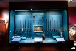 Photo shows a display of weapons used during the Revolutionary War, including a fife and drum, at the Museum of the American Revolution in Philadelphia.