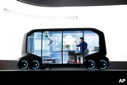 Toyota's e-Pallet concept is unveiled during a news conference at CES International, Monday, Jan. 8, 2018, in Las Vegas. (AP Photo/Jae C. Hong)