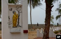 Sri Lankan soldiers stand guard outside St. Joseph's church in Thannamunai, Sri Lanka, April 30, 2019.