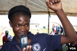 The winner with his prize… (D. Taylor/VOA)