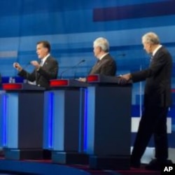 Massachusetts Gov. Mitt Romney; former House Speaker Newt Gingrich; and Rep. Ron Paul, R-Texas take part in the South Carolina Republican presidential candidate debate in Myrtle Beach, S.C, January 16, 2012.