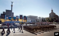 Ukrainian army soldiers march on Khreshchatyk street during military parade on the occasion of Ukraine's Independence Day in the capital Kyiv, Ukraine, Monday, Aug. 24, 2015.