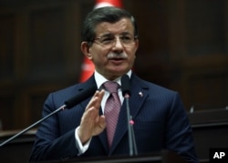 FILE - Turkish Prime Minister Ahmet Davutoglu addresses lawmakers in Ankara, Jan. 26, 2016.