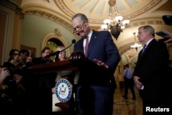 Senate Minority Leader Chuck Schumer, accompanied by Sen. Dick Durbin (D-IL) and Sen. Patty Murray (D-WA), speaks with reporters following the party luncheons on Capitol Hill in Washington, Jan. 23, 2018.