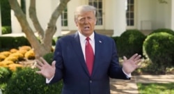 U.S. President Donald Trump makes an announcement about his treatment for coronavirus disease (COVID-19), in Washington, U.S., in this still image taken from video, October 7, 2020.