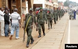 FILE - Congolese soldiers patrol to prevent civilians from protesting against the government's failure to stop the killings and inter-ethnic tensions in the town of Butembo, North Kivu province in the Democratic Republic of Congo, Aug. 25, 2016.