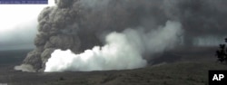 This view from a U.S. Geological Survey webcam shows small explosive episodes at Halema'uma'u Crater at Kīlauea Volcano's summit, which scientists say are caused by magma withdrawing from a shallow reservoir beneath the east margin of the crater, in Hawaii Volcanoes National Park on the island of Hawaii, May 25, 2018.