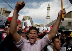 Demonstrators protesting the death of slain Jordanian pilot Muath al-Kaseabeh chant anti-Islamic State slogans during a rally Friday in Amman, Jordan.